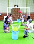 Photograph : They are enjoying original game with sitting on a chair or ground.